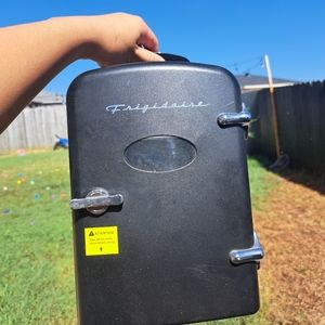 Solid black mini fridge.